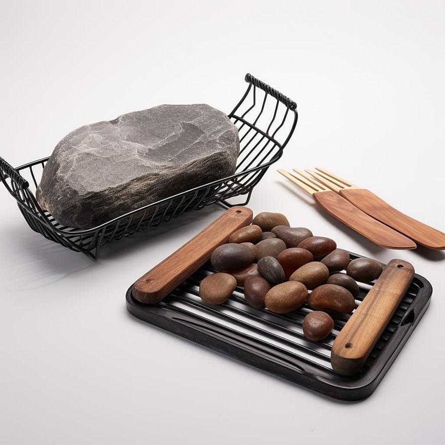 Grilling accessories including a grill basket and grilling stone