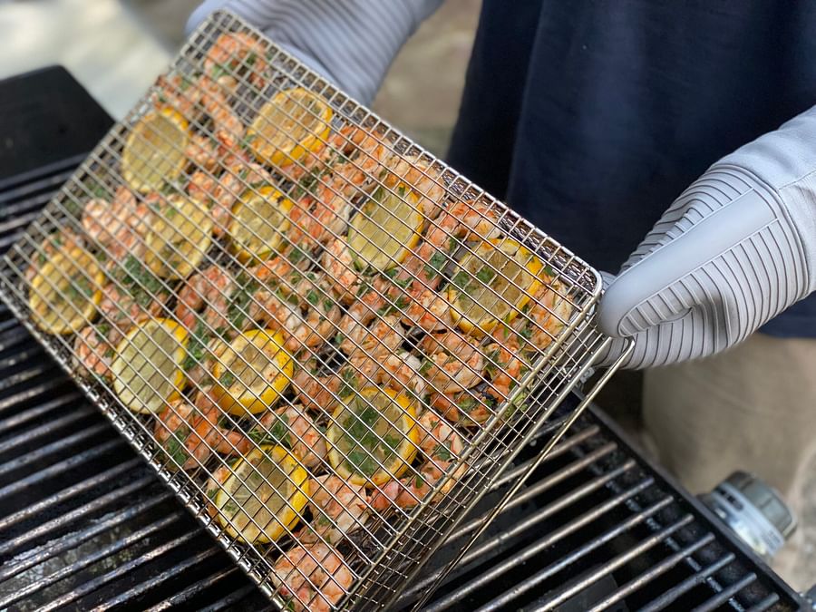Variety of delicious food being grilled in a basket
