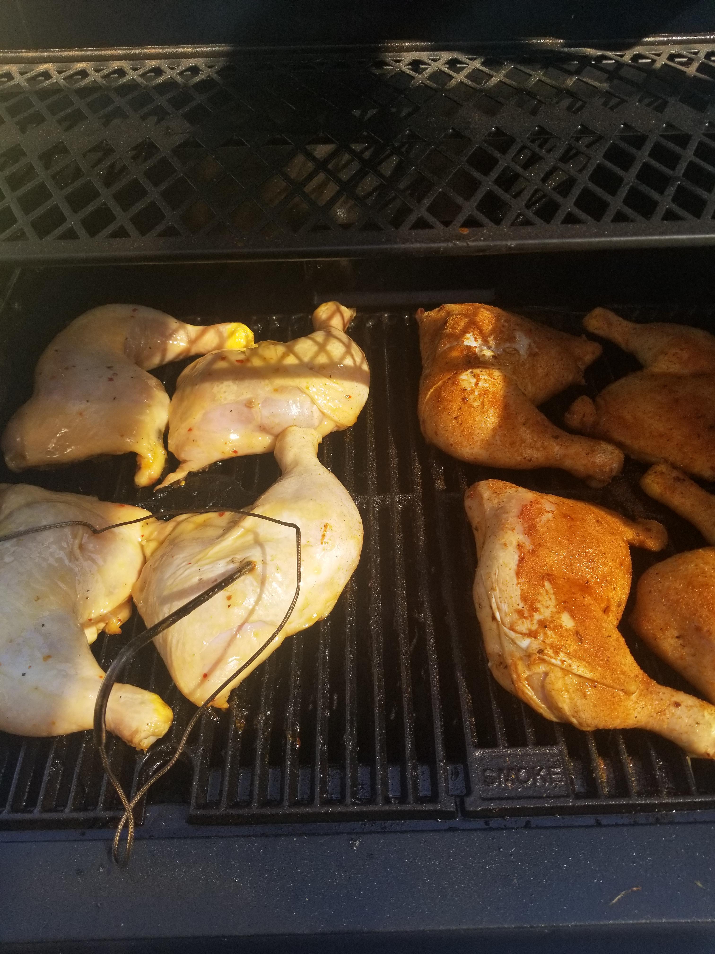 BBQ chicken leg with a meat thermometer showing the internal temperature